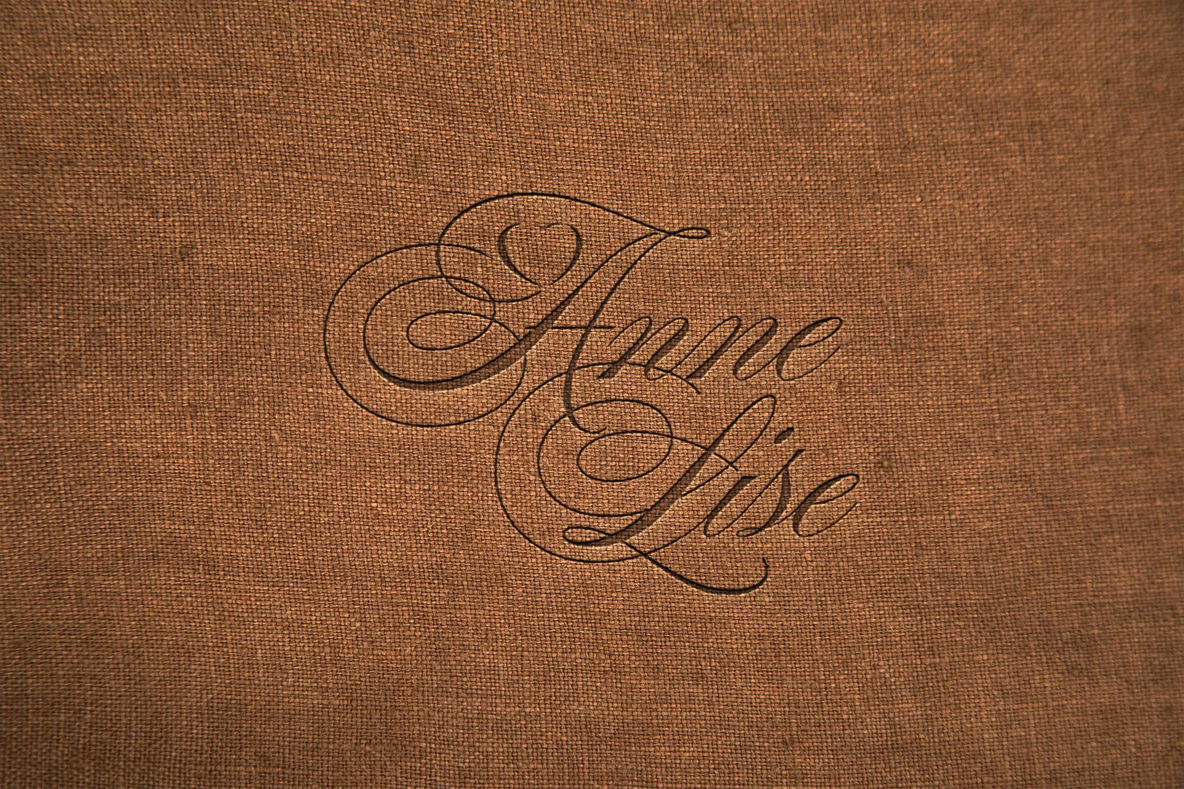 The custom signature, presented on a warm textured surface.