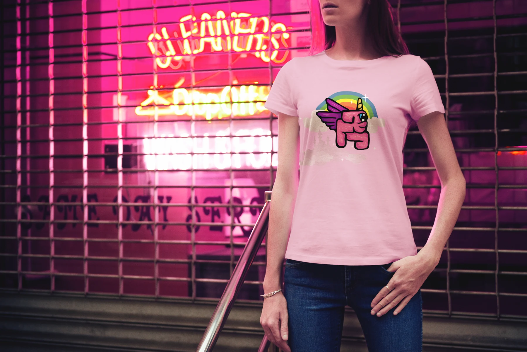 Unicorn — a bright character graphic on a pink T-shirt.