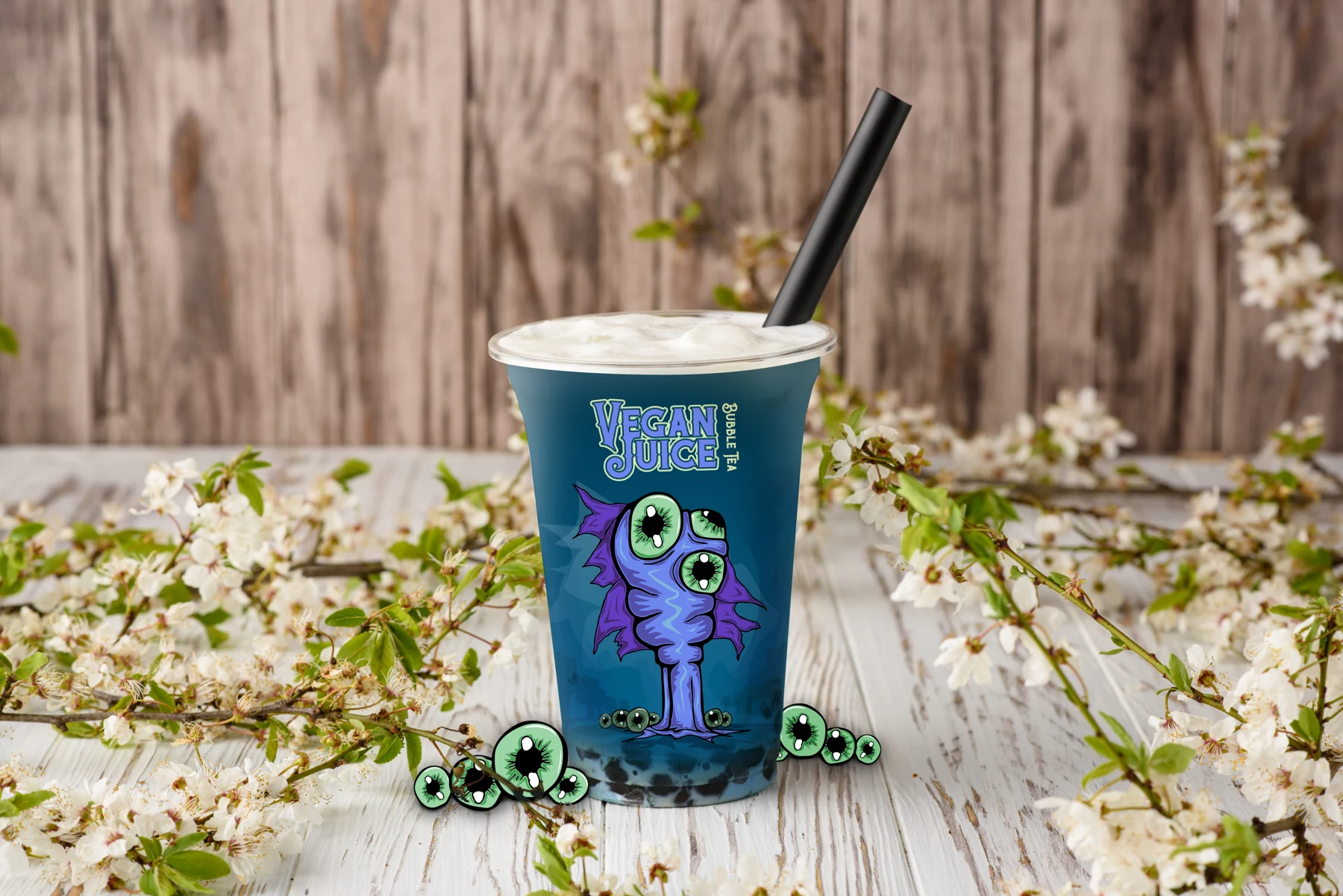 Vegan Juice bubble tea cup with the purple alien character and green companions